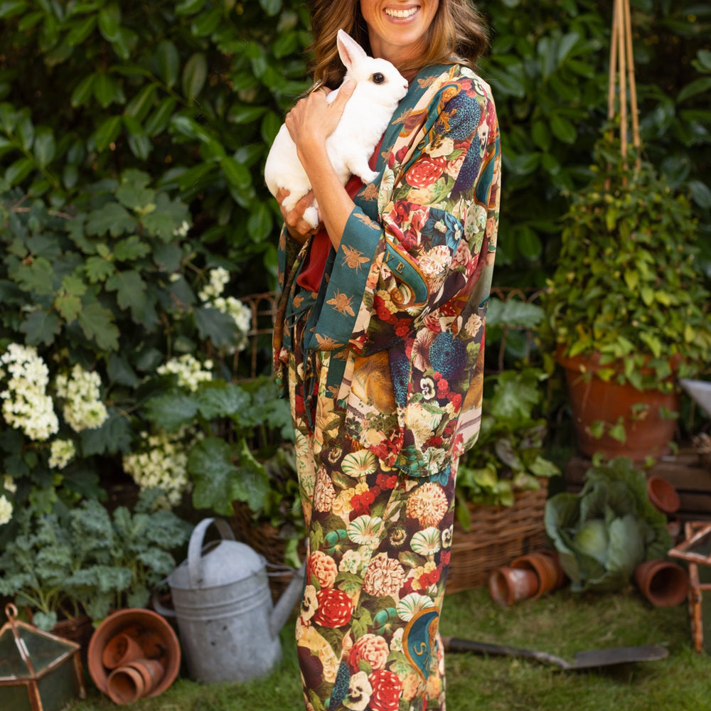 
                  
                    Model wearing Stay Gold linen Artist Pants with lantern hem and floral collage featuring vintage wildflower, bee, and rabbit illustrations – Market of Stars
                  
                