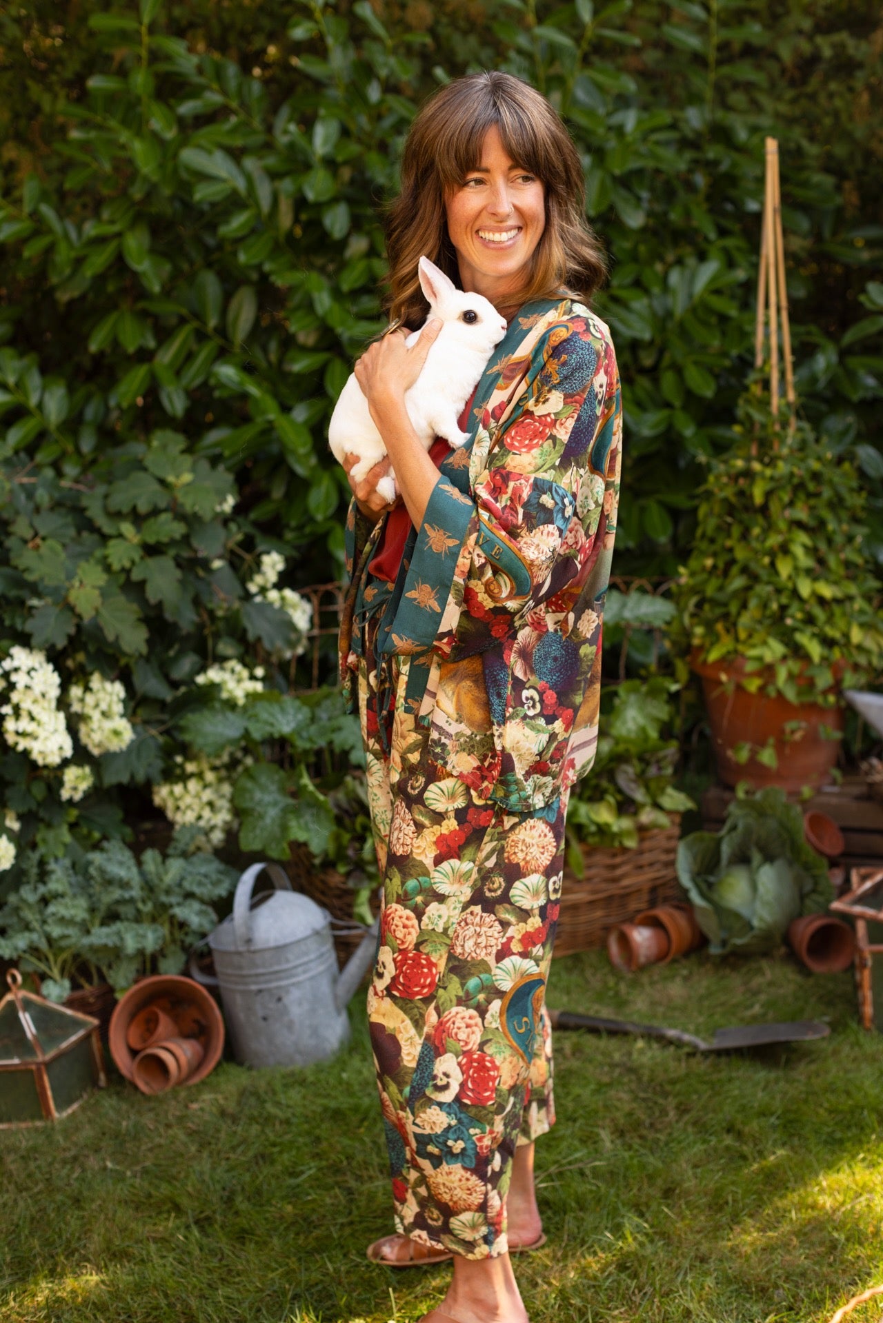 Model wearing Stay Gold linen Artist Pants with lantern hem and floral collage featuring vintage wildflower, bee, and rabbit illustrations – Market of Stars