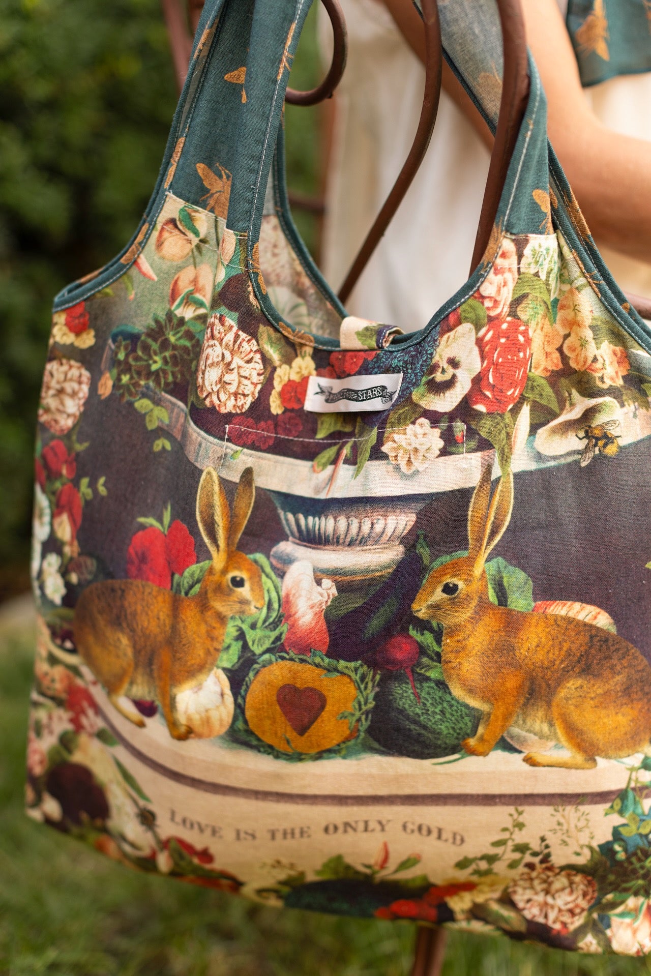 Stay Gold Market Tote featuring a vibrant vintage-inspired wildflower collage with bunny rabbits and bumblebees in a sturdy cotton canvas design – Market of Stars
