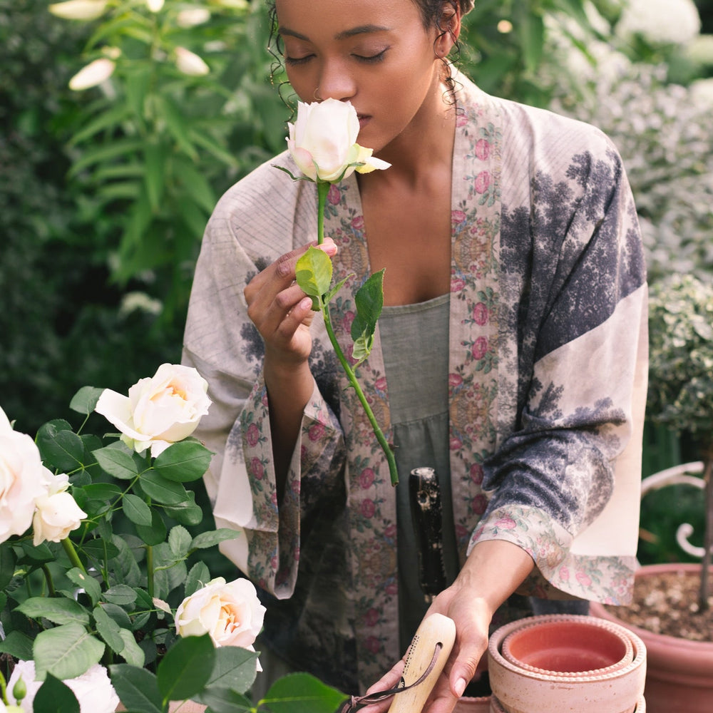 
                  
                    Model wearing our Still I Rise Pixie Duster with empowering message a bold, layered design featuring antique landscape etchings – Market of Stars
                  
                