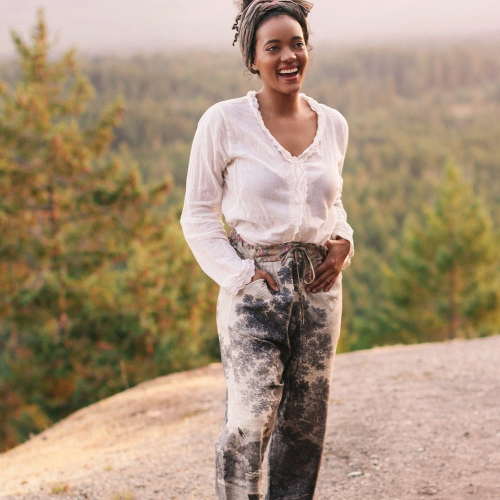 
                  
                    Linen Still I Rise Artist Pants with lantern hem, featuring antique landscape etchings in a rich, layered print celebrating resilience – Market of Stars
                  
                