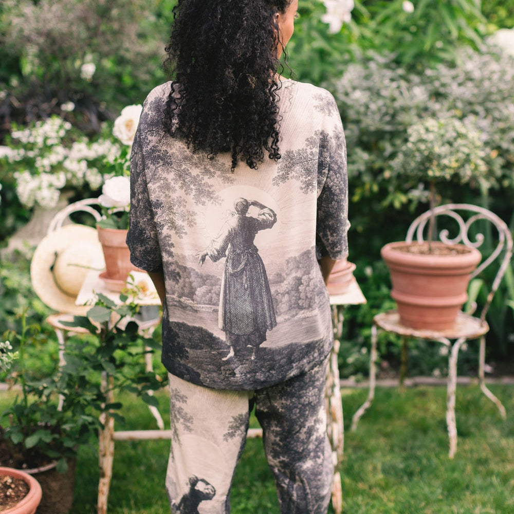 
                  
                    Linen Still I Rise Artist Pants with lantern hem, featuring antique landscape etchings in a rich, layered print celebrating resilience – Market of Stars
                  
                
