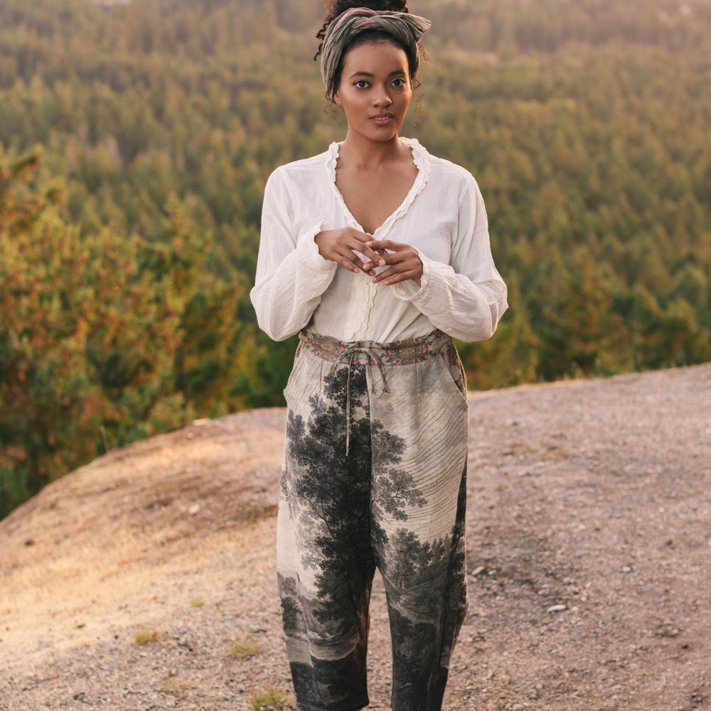 
                  
                    Linen Still I Rise Artist Pants with lantern hem, featuring antique landscape etchings in a rich, layered print celebrating resilience – Market of Stars
                  
                