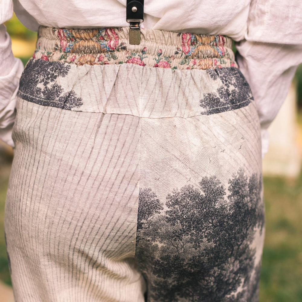 
                  
                    Linen Still I Rise Artist Pants with lantern hem, featuring antique landscape etchings in a rich, layered print celebrating resilience – Market of Stars
                  
                