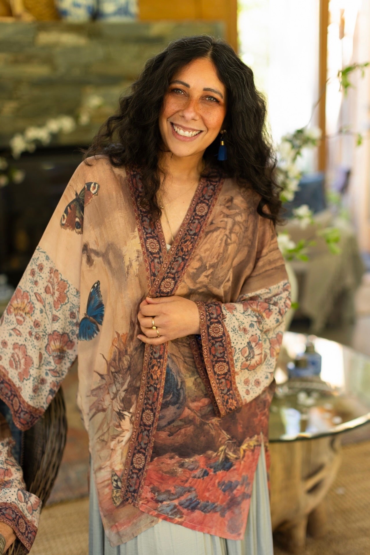 Model(s) wearing The Storyteller -- a mid-length Matinée kimono duster featuring antique artwork and vintage prints from around the world -- Market of Stars