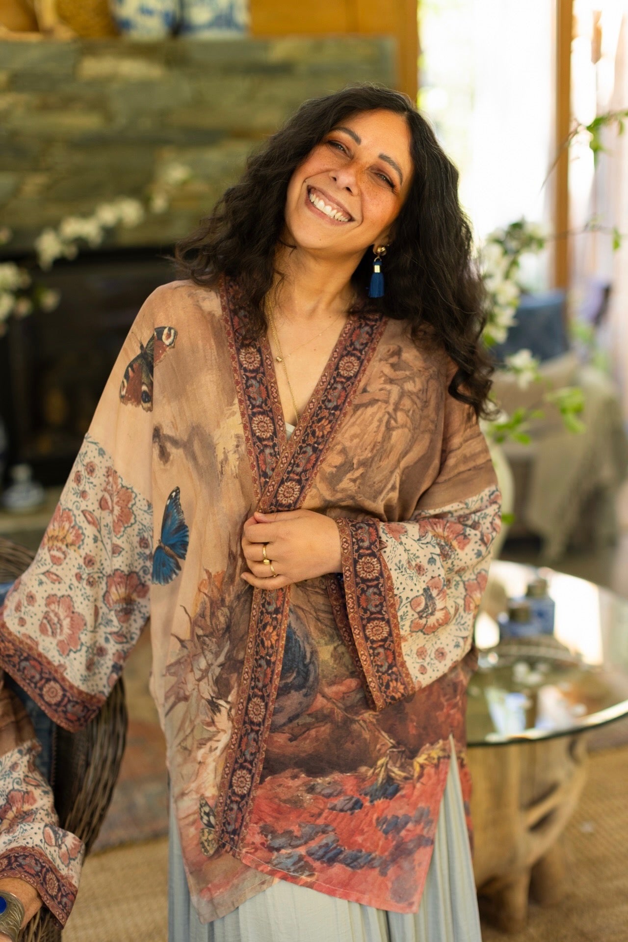 Model(s) wearing The Storyteller -- a mid-length Matinée kimono duster featuring antique artwork and vintage prints from around the world -- Market of Stars