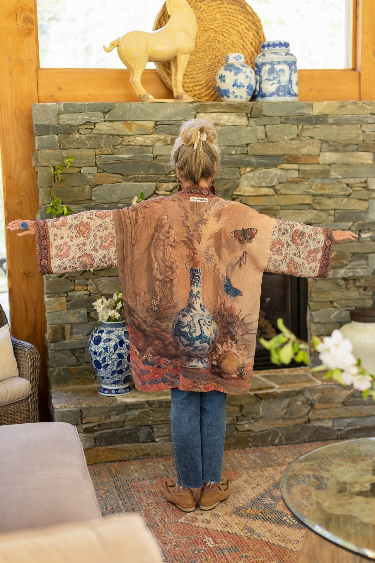Model(s) wearing The Storyteller -- a mid-length Matinée kimono duster featuring antique artwork and vintage prints from around the world -- Market of Stars