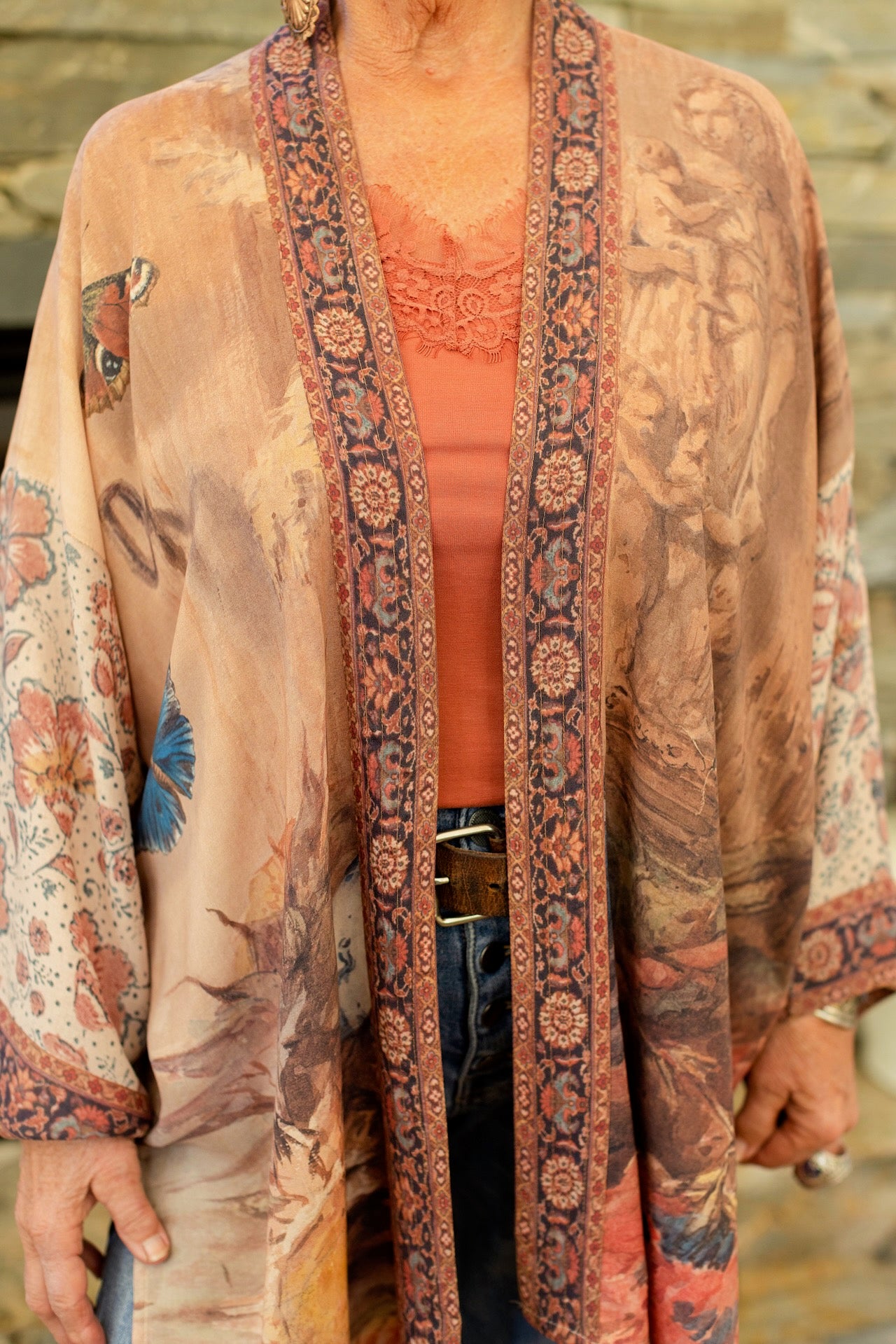 Model(s) wearing The Storyteller -- a mid-length Matinée kimono duster featuring antique artwork and vintage prints from around the world -- Market of Stars