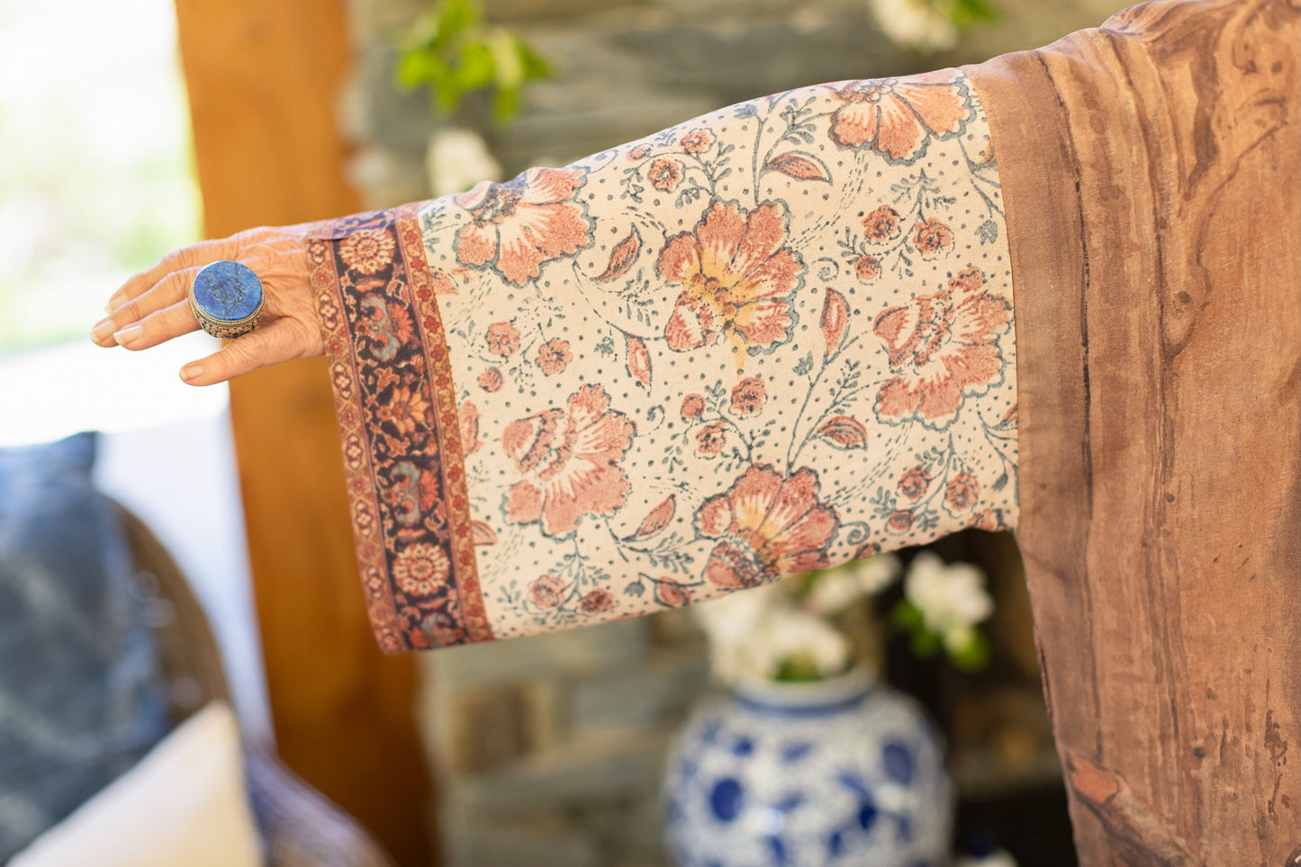 Model(s) wearing The Storyteller -- a mid-length Matinée kimono duster featuring antique artwork and vintage prints from around the world -- Market of Stars