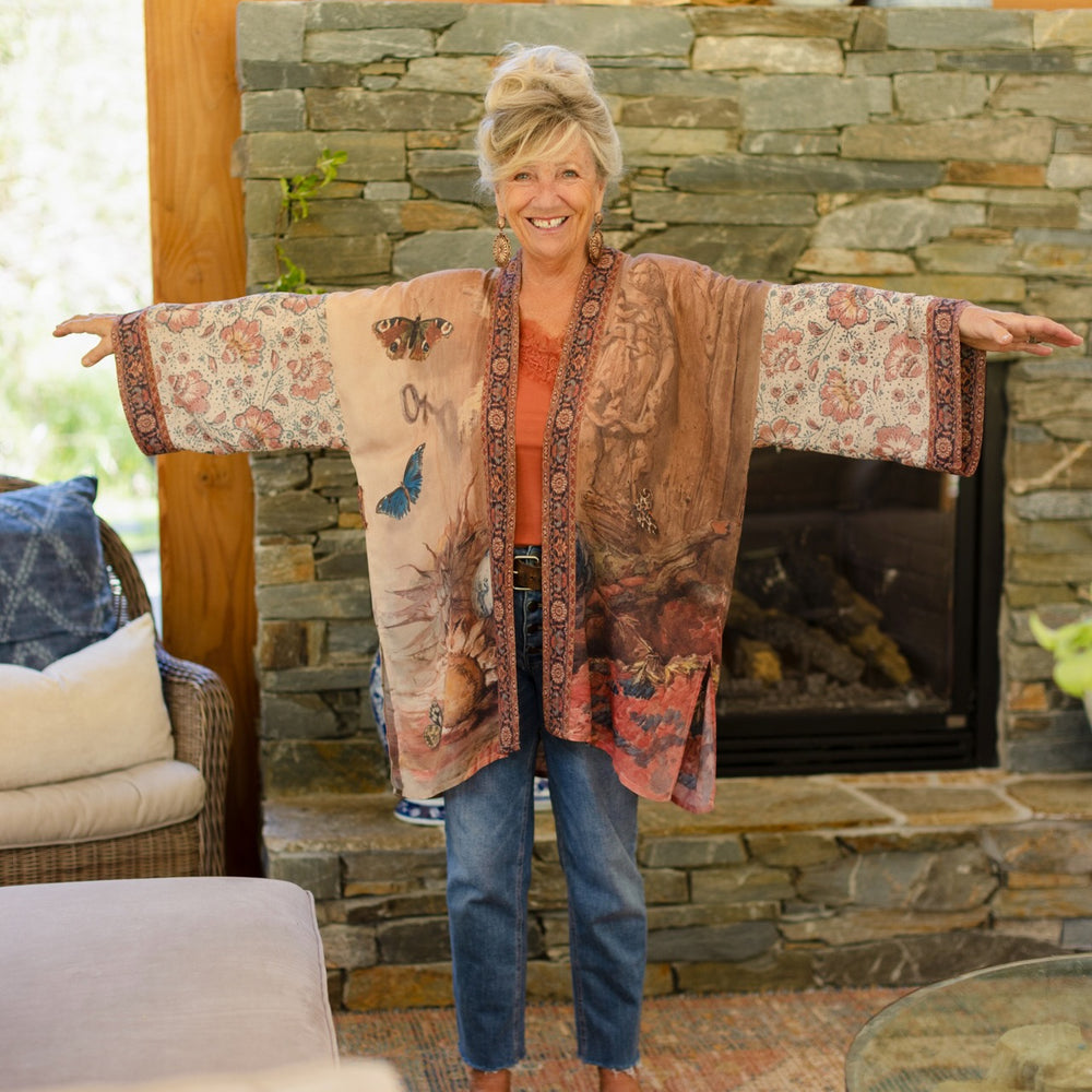 
                  
                    Model(s) wearing The Storyteller -- a mid-length Matinée kimono duster featuring antique artwork and vintage prints from around the world -- Market of Stars
                  
                