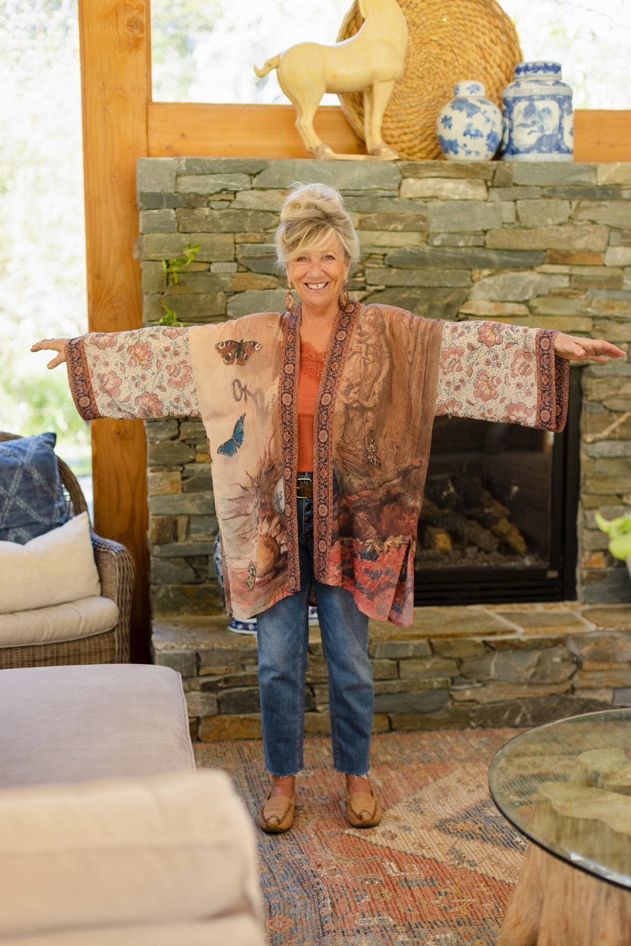 Model(s) wearing The Storyteller -- a mid-length Matinée kimono duster featuring antique artwork and vintage prints from around the world -- Market of Stars