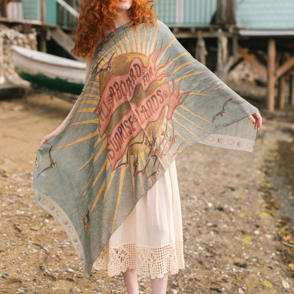 Lightweight scarf featuring a dreamy sunrise landscape and nautical artwork with the words "All aboard for Sunrise Lands" – Market of Stars