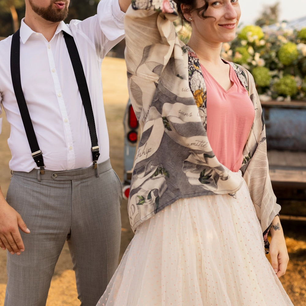
                  
                    A joyful blend of 17th-century engravings, painted hearts, and hand-coloured florals on our cropped Take My Hand Pixie duster kimono – Market of Stars
                  
                