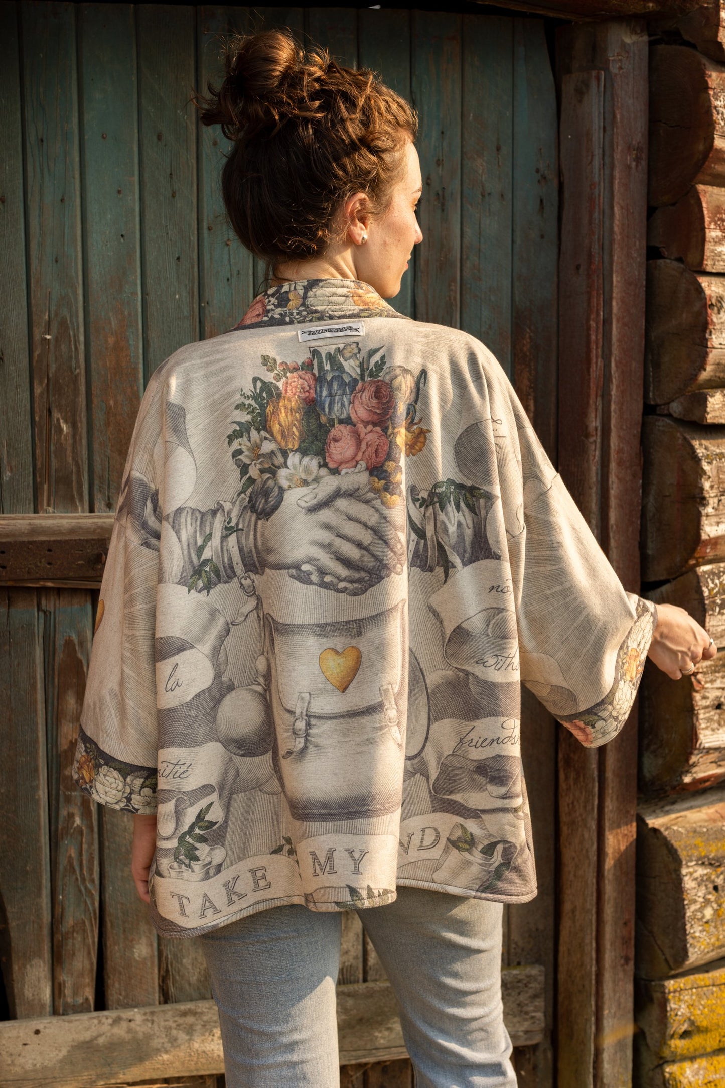 A cozy cardigan lined in fleece featuring Victorian collage artwork and the phrase “Life is nothing without friendship” – Market of Stars
