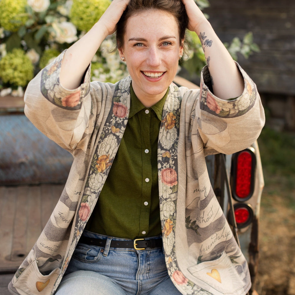A cozy cardigan lined in fleece featuring Victorian collage artwork and the phrase “Life is nothing without friendship” – Market of Stars