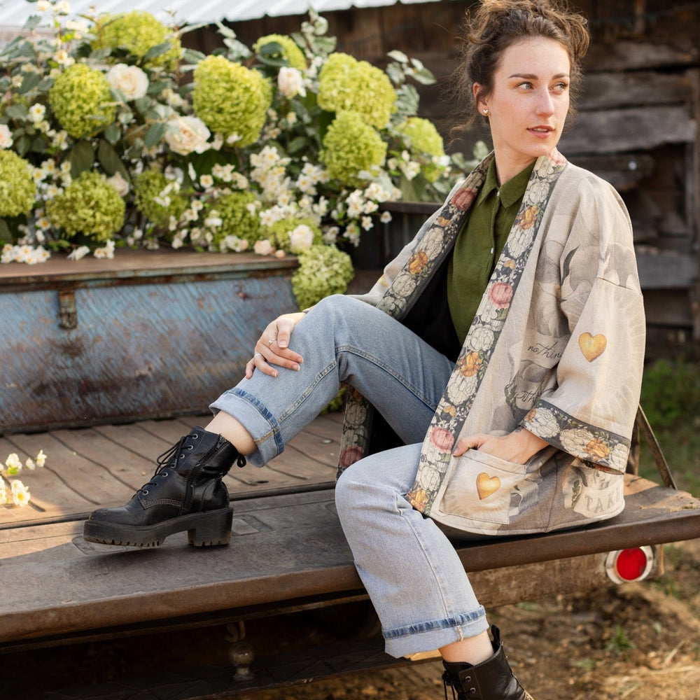 
                  
                    A cozy cardigan lined in fleece featuring Victorian collage artwork and the phrase “Life is nothing without friendship” – Market of Stars
                  
                