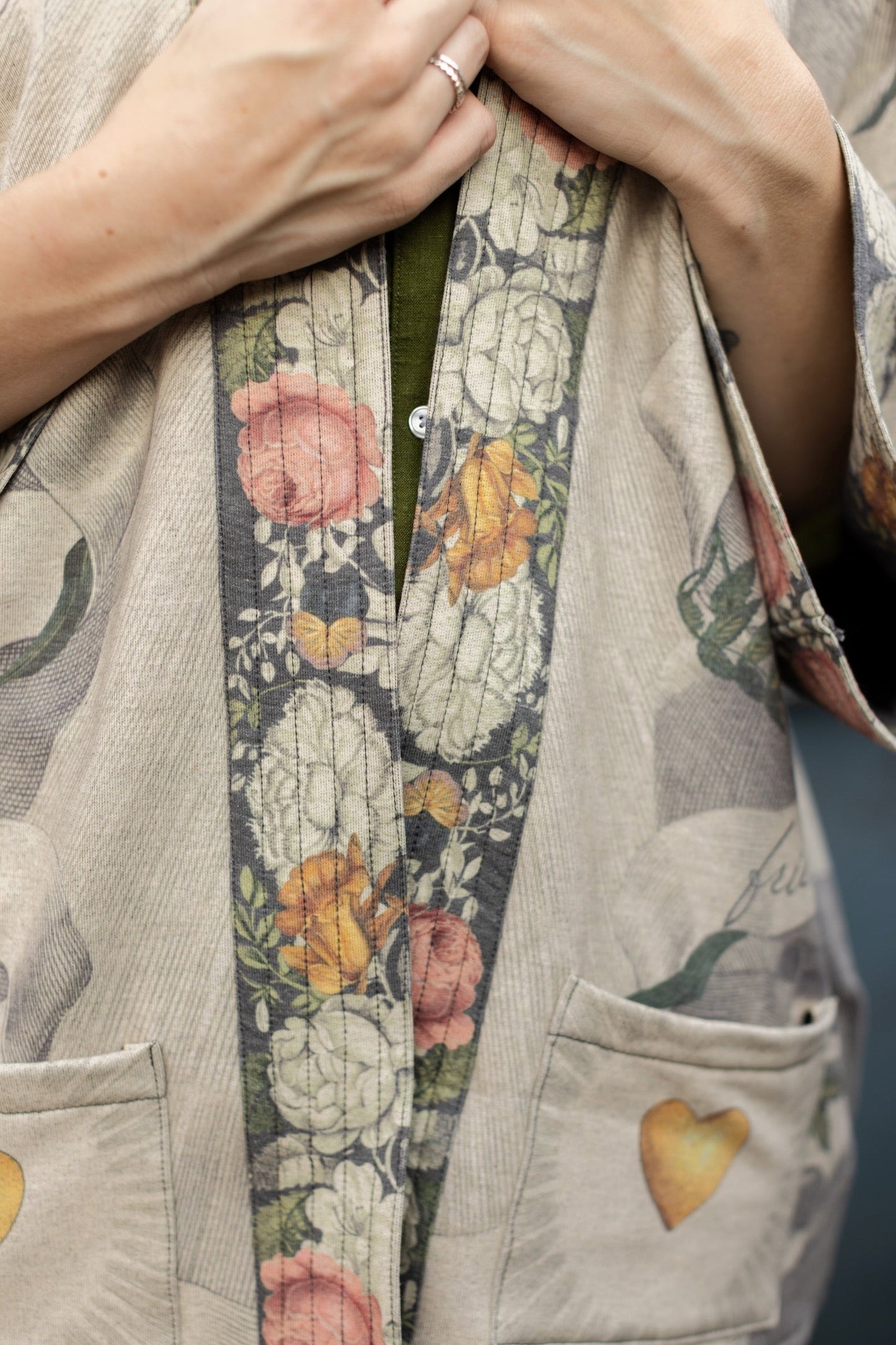 A cozy cardigan lined in fleece featuring Victorian collage artwork and the phrase “Life is nothing without friendship” – Market of Stars