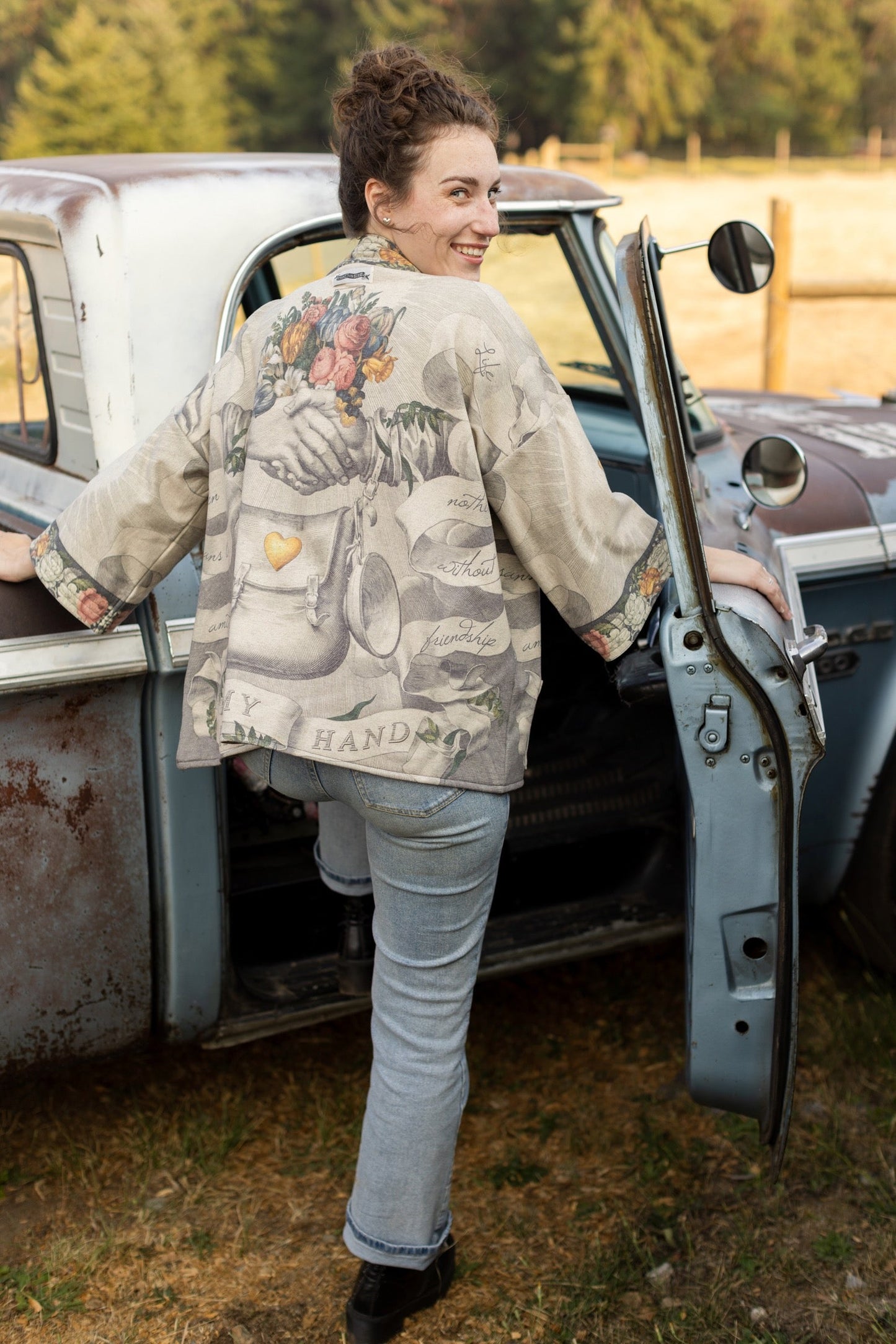 A cozy cardigan lined in fleece featuring Victorian collage artwork and the phrase “Life is nothing without friendship” – Market of Stars