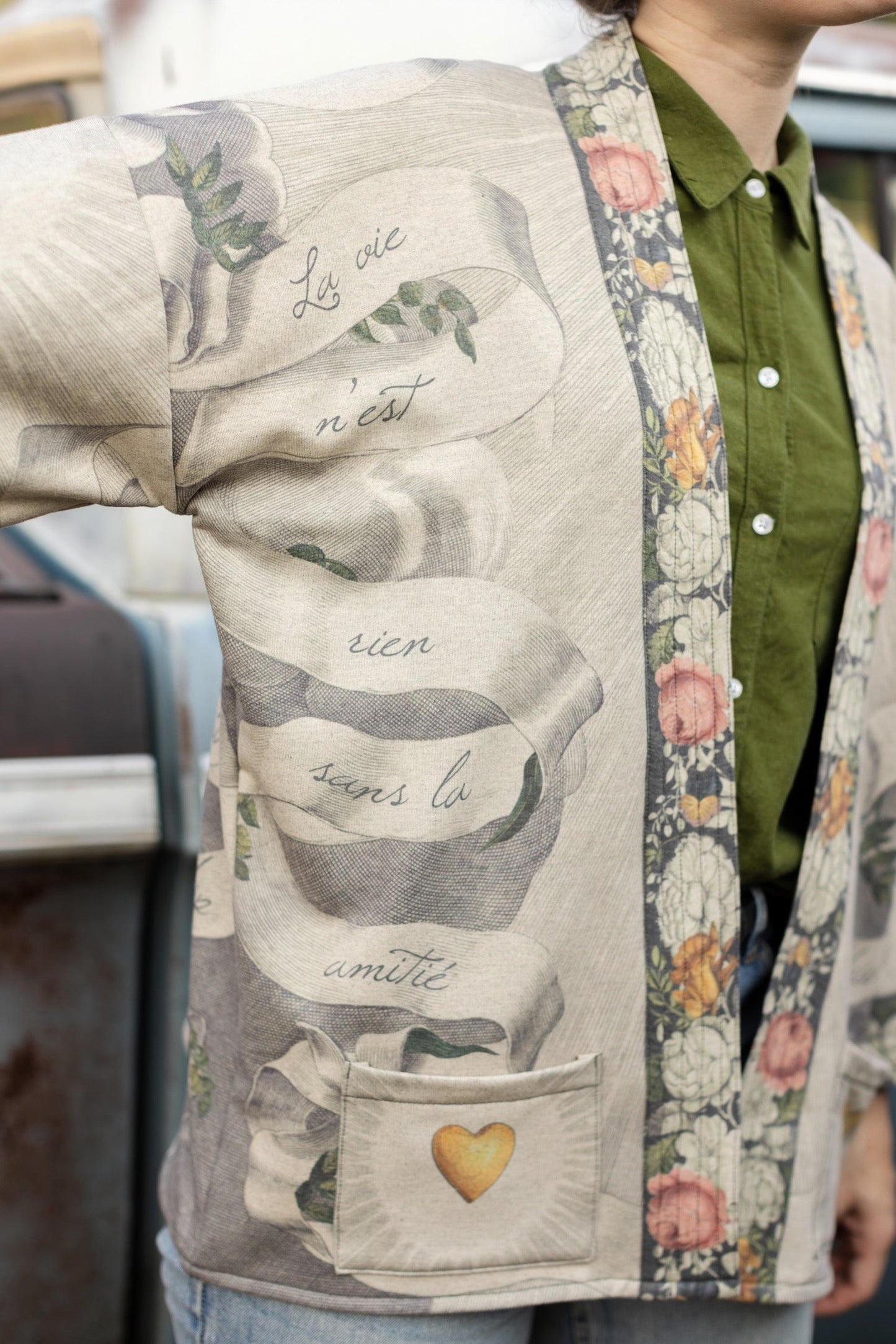 A cozy cardigan lined in fleece featuring Victorian collage artwork and the phrase “Life is nothing without friendship” – Market of Stars