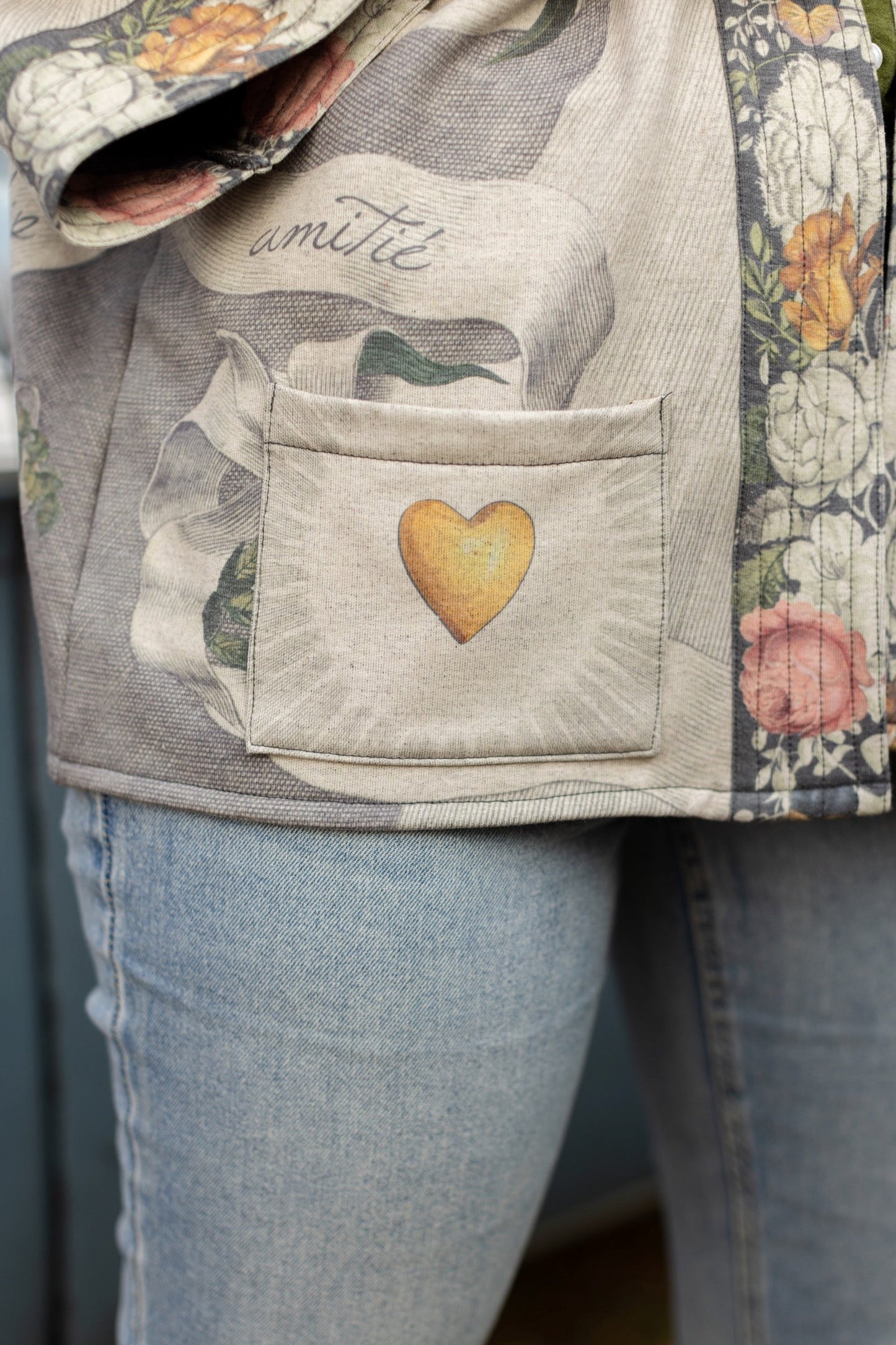 A cozy cardigan lined in fleece featuring Victorian collage artwork and the phrase “Life is nothing without friendship” – Market of Stars