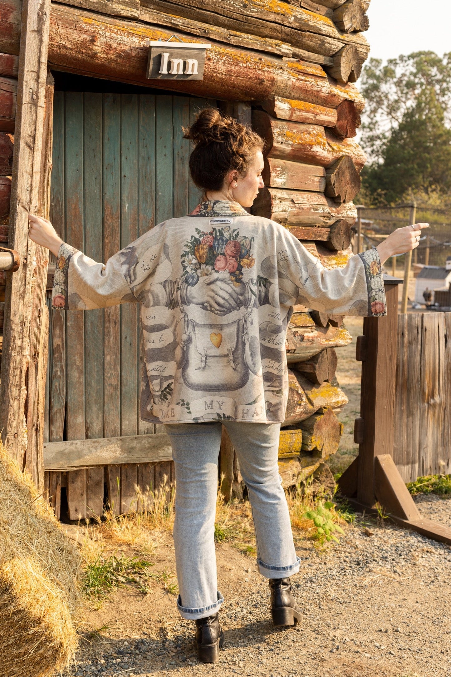 A cozy cardigan lined in fleece featuring Victorian collage artwork and the phrase “Life is nothing without friendship” – Market of Stars