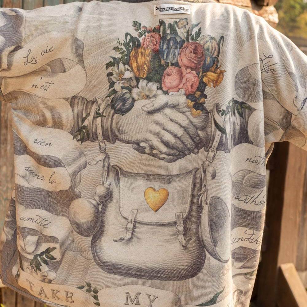 
                  
                    A cozy cardigan lined in fleece featuring Victorian collage artwork and the phrase “Life is nothing without friendship” – Market of Stars
                  
                