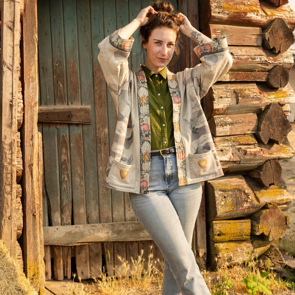 
                  
                    A cozy cardigan lined in fleece featuring Victorian collage artwork and the phrase “Life is nothing without friendship” – Market of Stars
                  
                