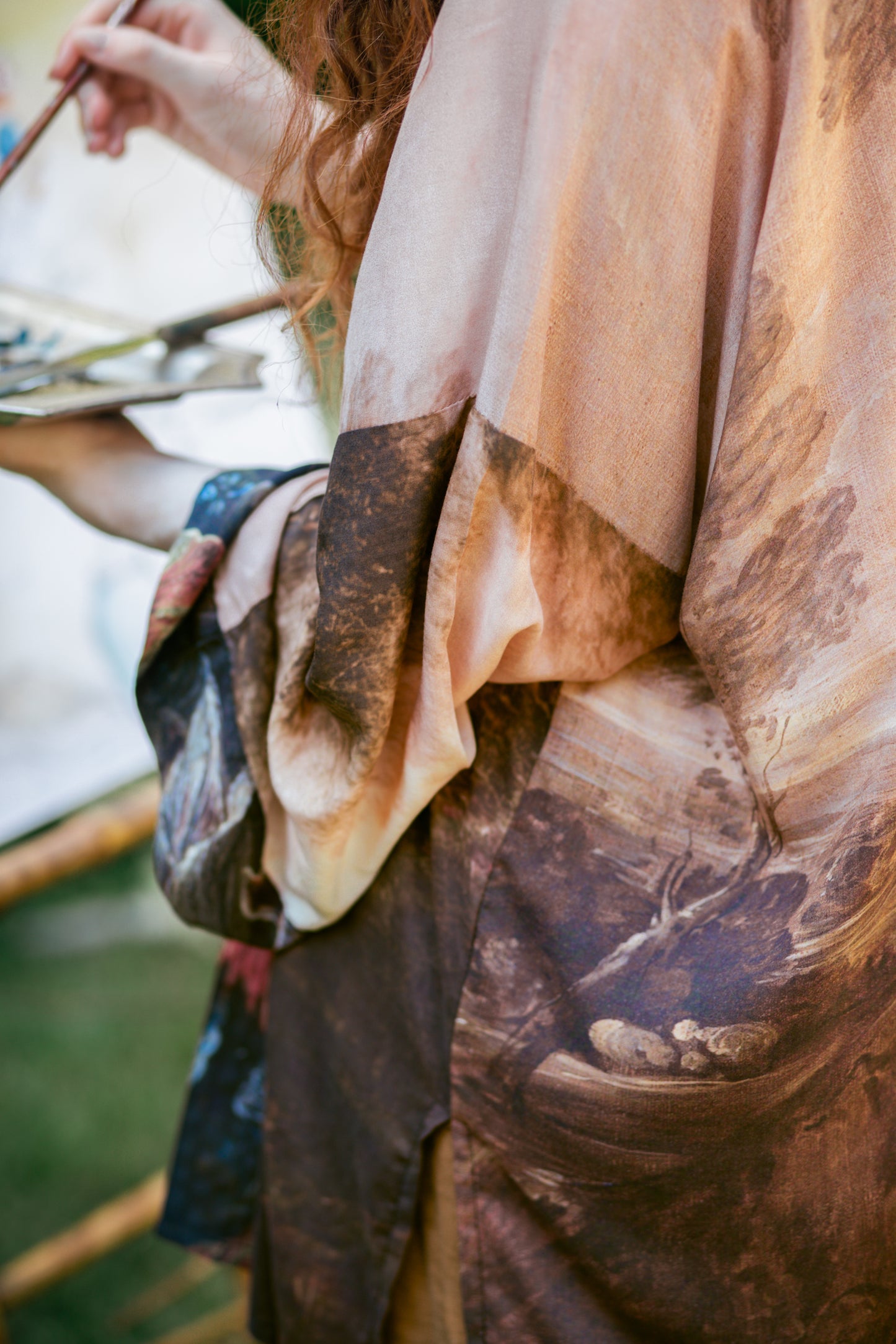 Model wearing The Artist kimono-style duster featuring antique paintings, botanical floral trim, and a radiant golden sun – Market of Stars