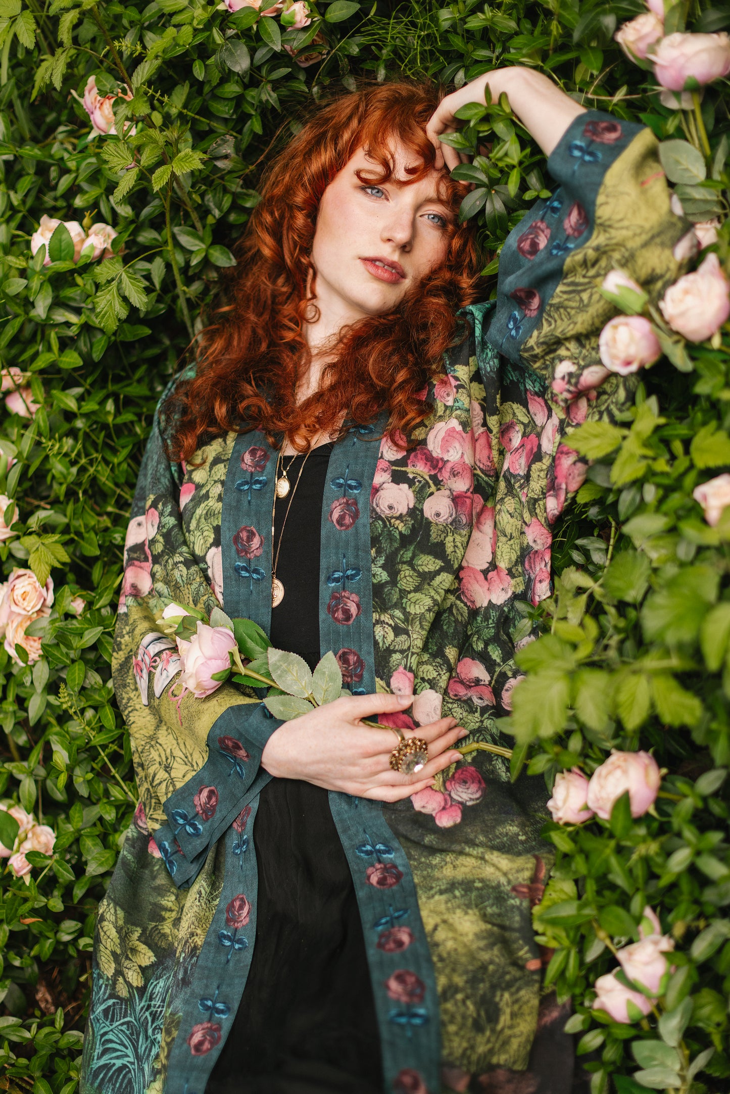 Model wearing a mid-length duster robe ft. hand-coloured etching from the 1880s called The Bower of Roses - Market of Stars