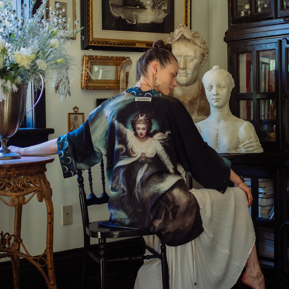 
                  
                    The Dreamer kimono jacket featuring a celestial Moon Goddess portrait with swirling sky detail and starry trim – Market of Stars
                  
                