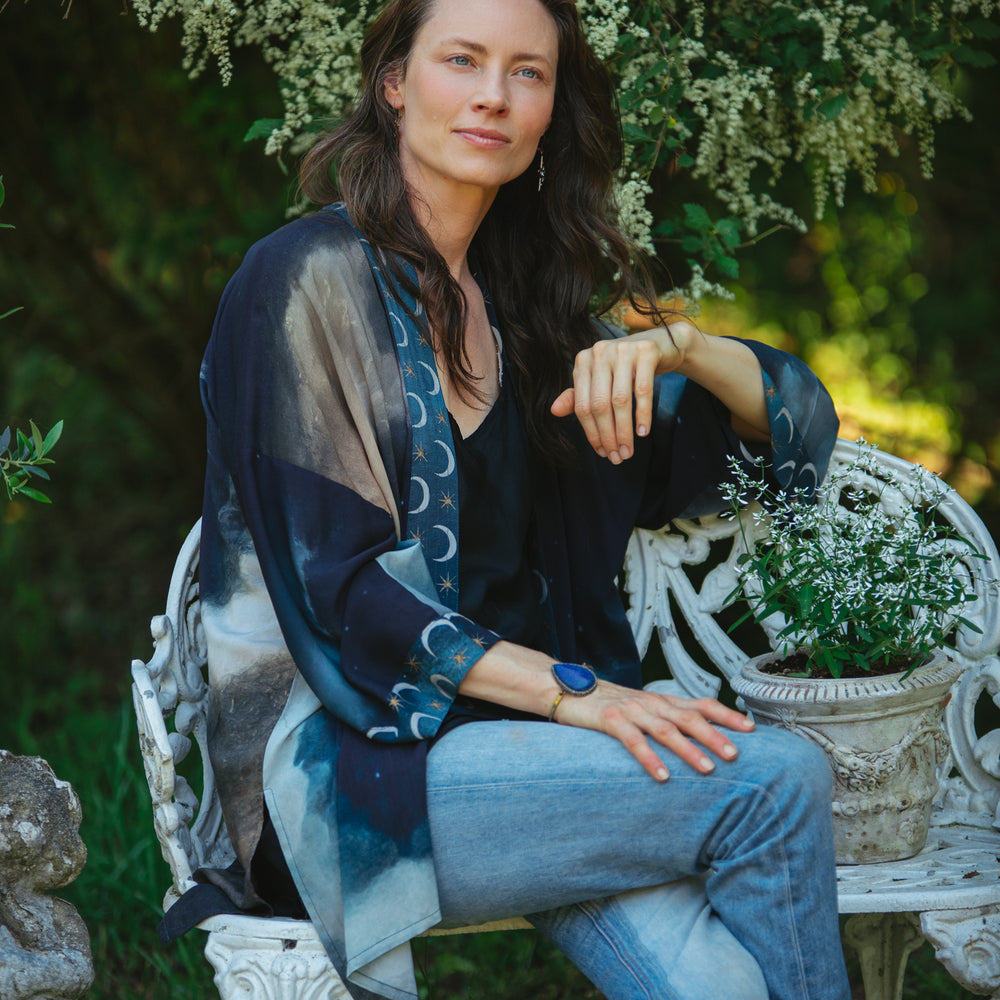 
                  
                    The Dreamer kimono jacket featuring a celestial Moon Goddess portrait with swirling sky detail and starry trim – Market of Stars
                  
                