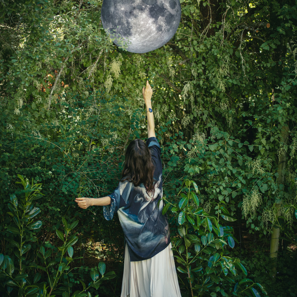 
                  
                    The Dreamer kimono jacket featuring a celestial Moon Goddess portrait with swirling sky detail and starry trim – Market of Stars
                  
                
