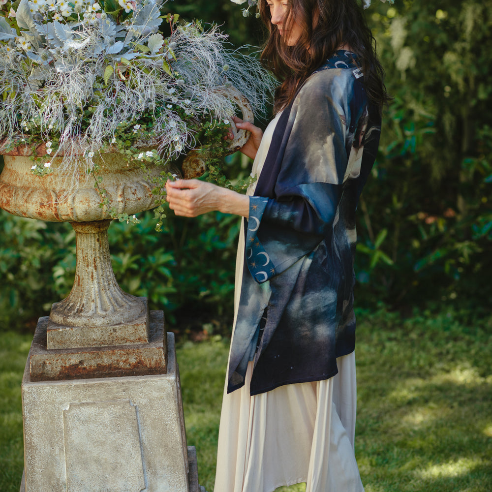 
                  
                    The Dreamer kimono jacket featuring a celestial Moon Goddess portrait with swirling sky detail and starry trim – Market of Stars
                  
                