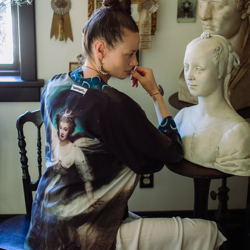 
                  
                    The Dreamer kimono jacket featuring a celestial Moon Goddess portrait with swirling sky detail and starry trim – Market of Stars
                  
                
