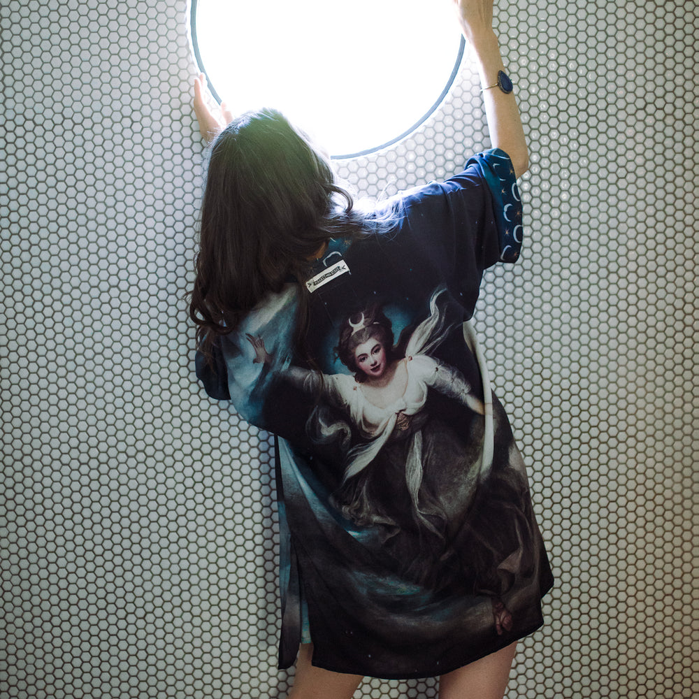 
                  
                    The Dreamer kimono jacket featuring a celestial Moon Goddess portrait with swirling sky detail and starry trim – Market of Stars
                  
                