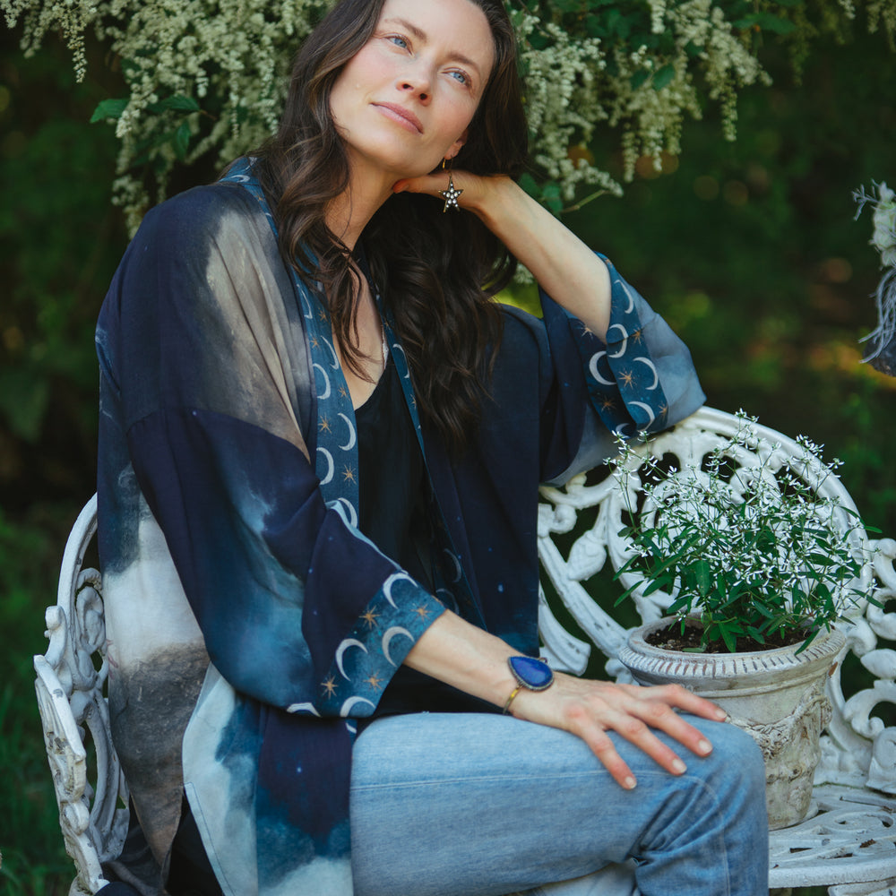 
                  
                    The Dreamer kimono jacket featuring a celestial Moon Goddess portrait with swirling sky detail and starry trim – Market of Stars
                  
                
