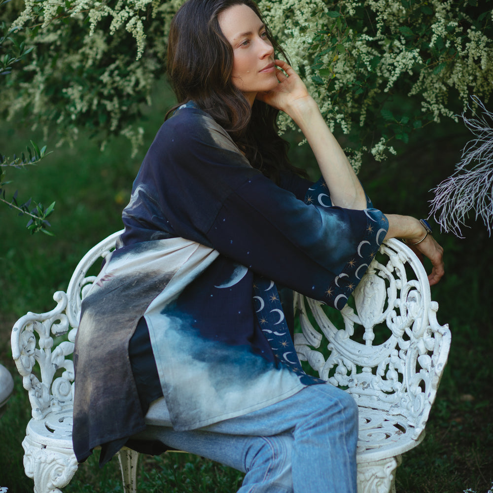 
                  
                    The Dreamer kimono jacket featuring a celestial Moon Goddess portrait with swirling sky detail and starry trim – Market of Stars
                  
                