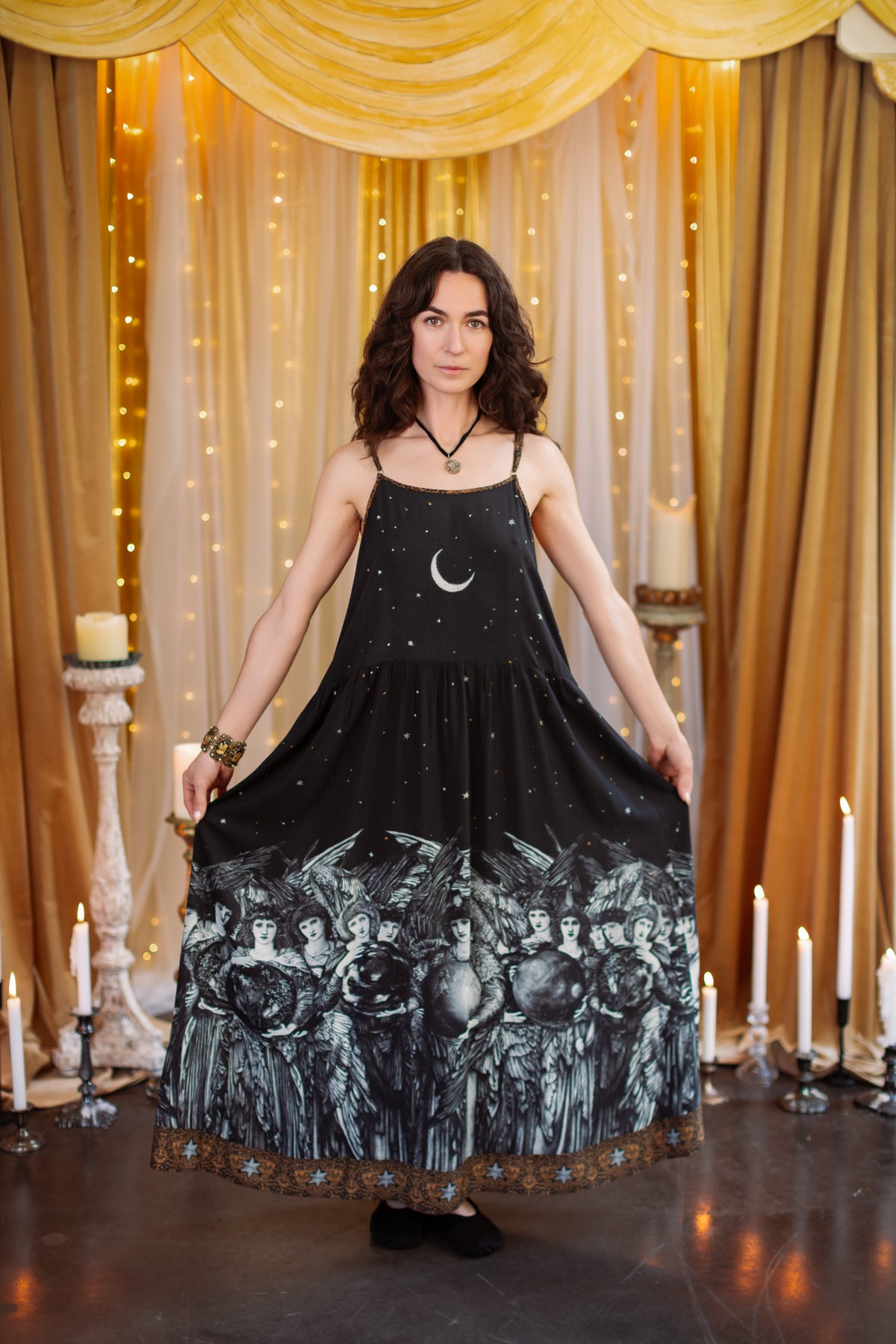 Model wearing a soft maxi-length slip dress with a celestial print ft. Burne-Jones angels, a moonlit sky, and vintage florals - Market of Stars.