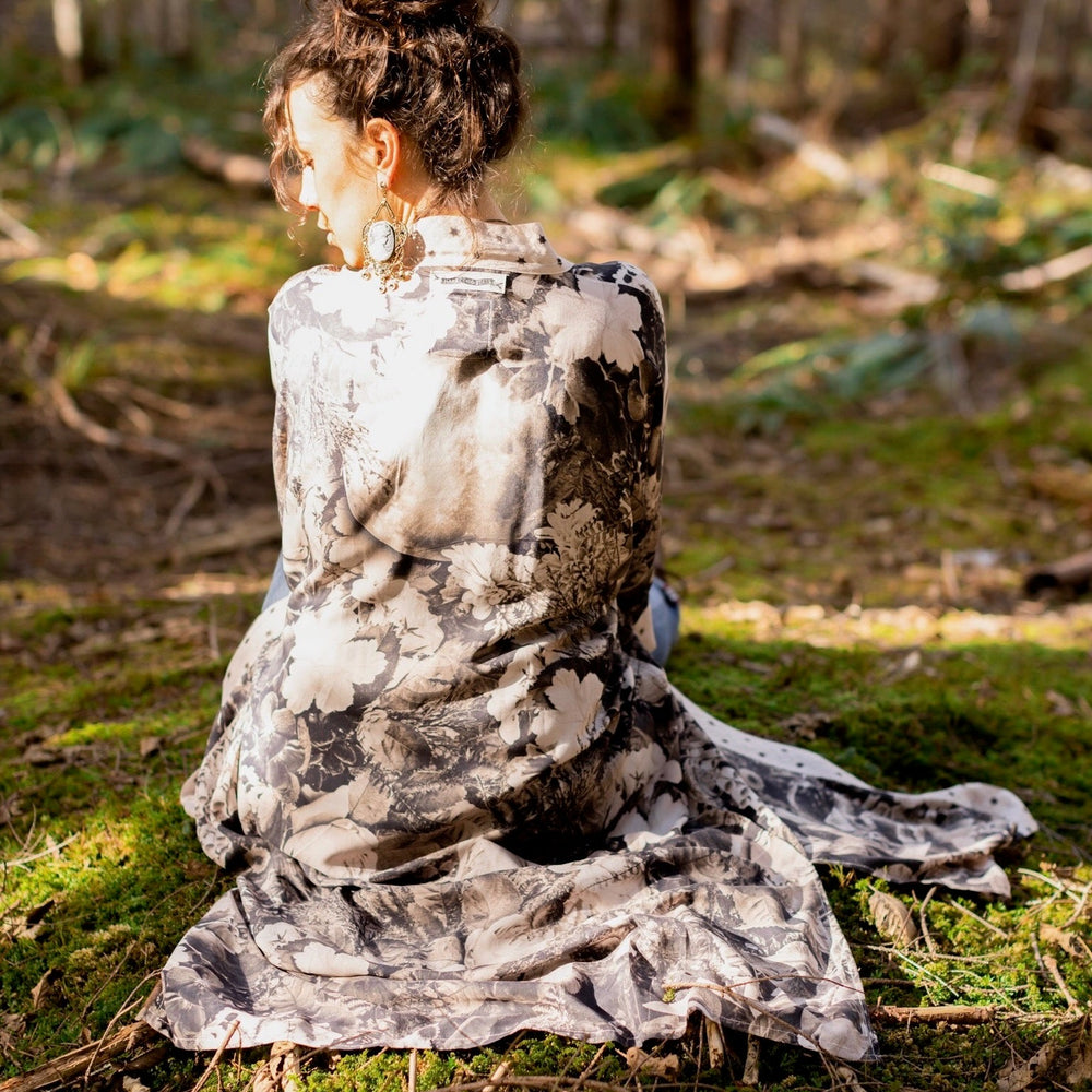 
                  
                    Model wearing Looking Glass Opera Robe featuring grown-up Alice Liddell, Victorian botanicals, and celestial star and moon accents inspired by Wonderland – Market of Stars.
                  
                