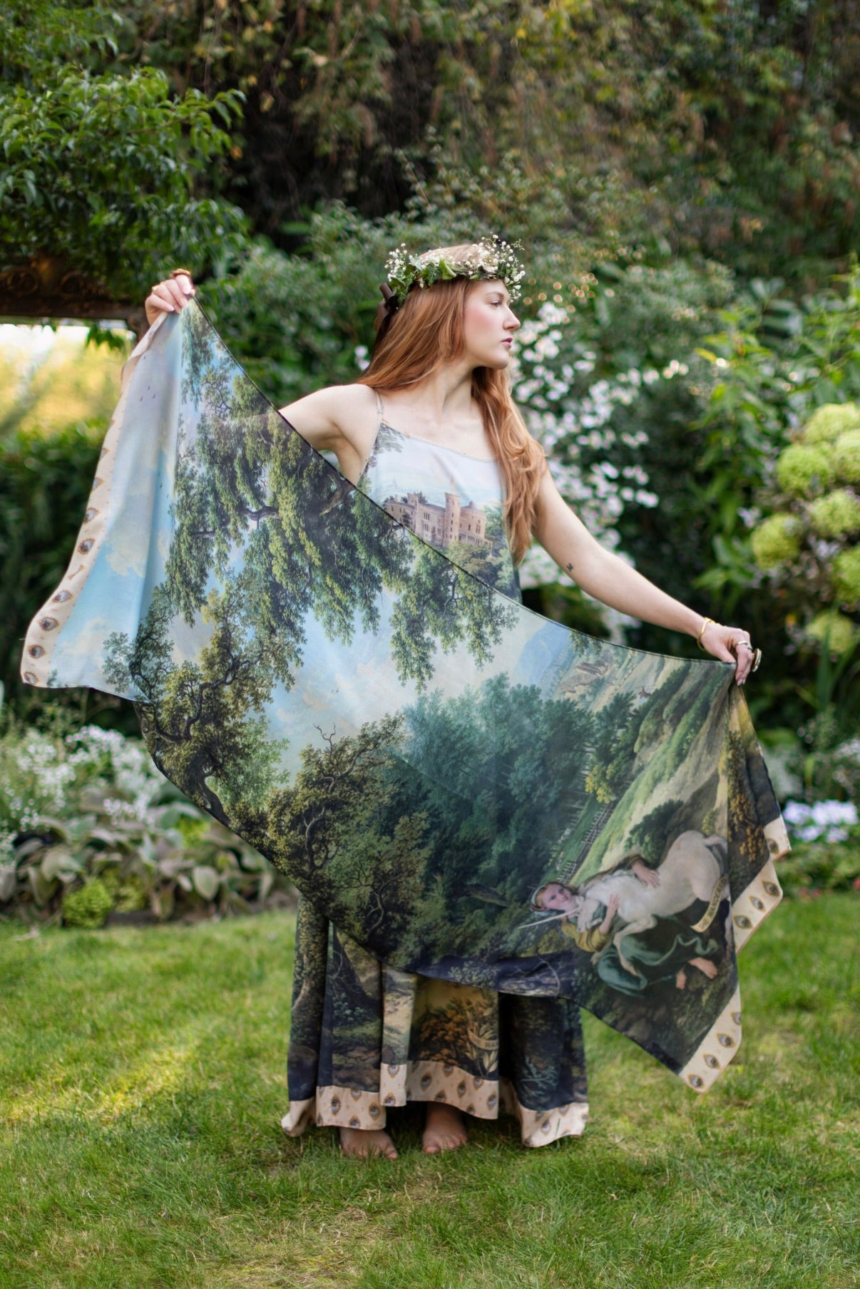 Model wearing a bamboo-viscose scarf ft. vintage artwork & unicorn lorn set against a mossy-green landscape — a romantic piece for the modern dreamer - Market of Stars