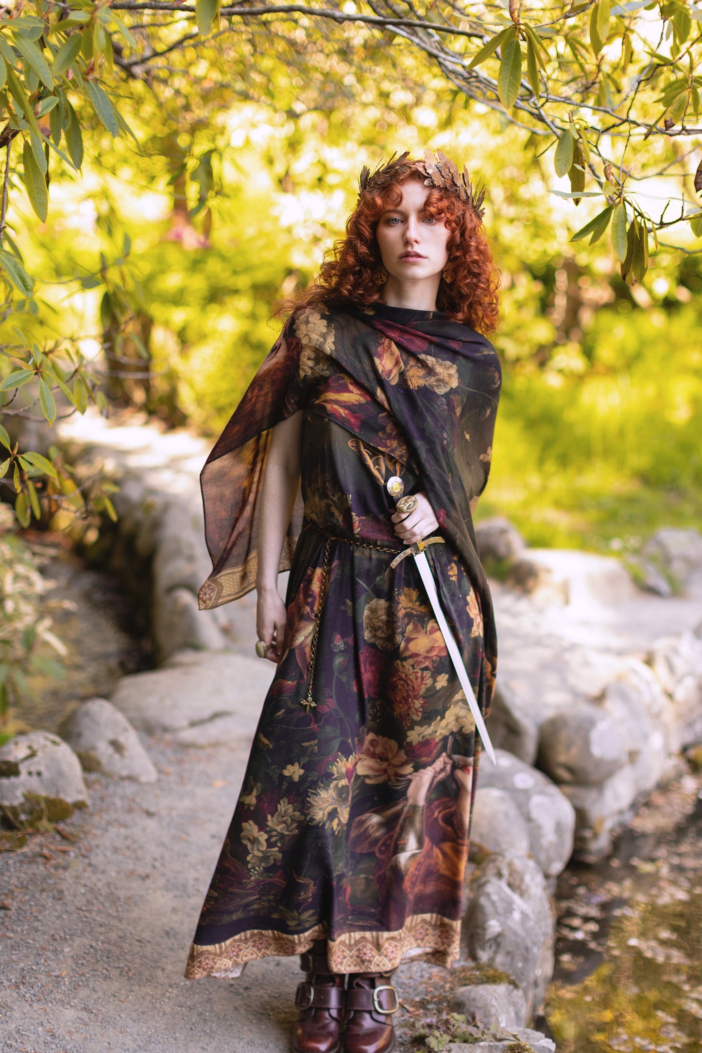 Model wearing a bamboo-viscose scarf featuring florals from centuries-old paintings and Rosetti’s iconic portrait of Joan of Arc - Market of Stars