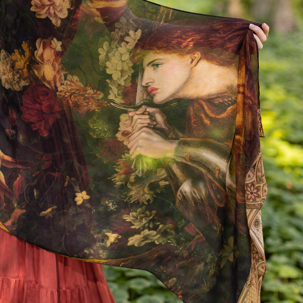 
                  
                    Model wearing a bamboo-viscose scarf featuring florals from centuries-old paintings and Rosetti’s iconic portrait of Joan of Arc - Market of Stars
                  
                