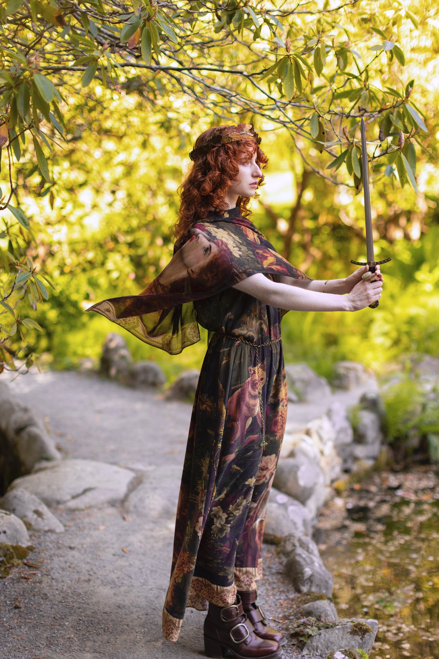 Model wearing a bamboo-viscose scarf featuring florals from centuries-old paintings and Rosetti’s iconic portrait of Joan of Arc - Market of Stars