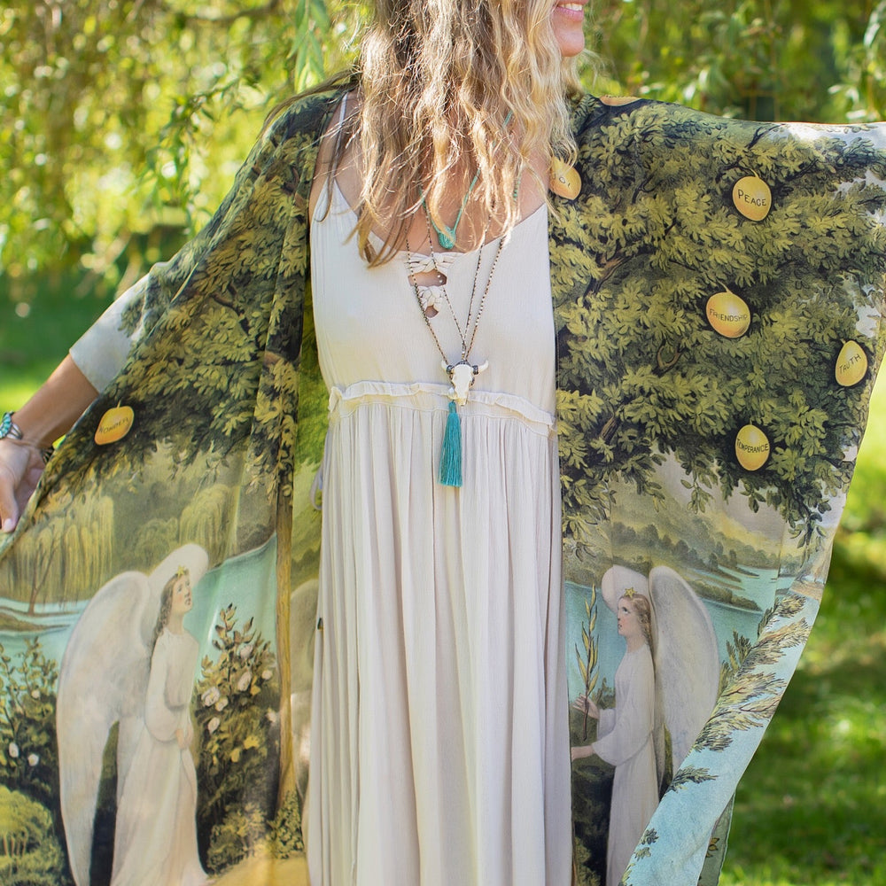 
                  
                    Model wearing Tree of Life Starduster celebrating growth renewal and timeless beauty – Market of Stars
                  
                