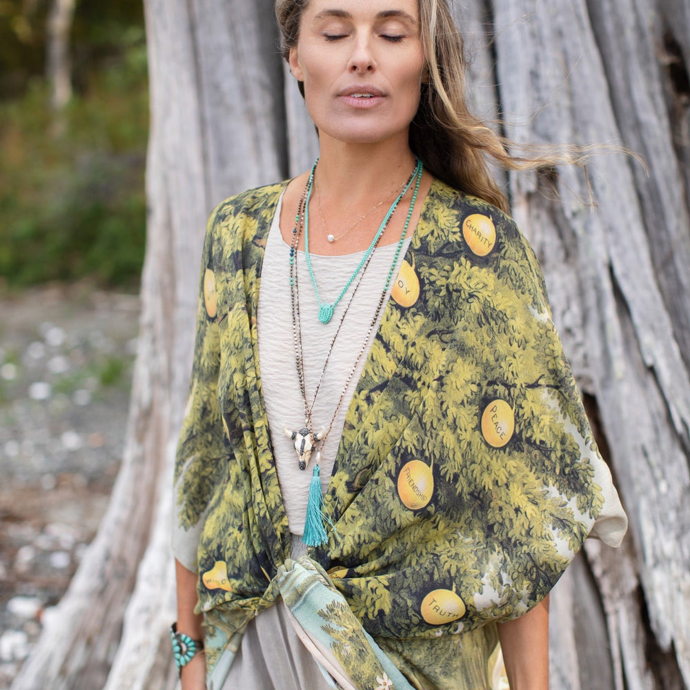 
                  
                    Model wearing Tree of Life Starduster celebrating growth renewal and timeless beauty – Market of Stars
                  
                