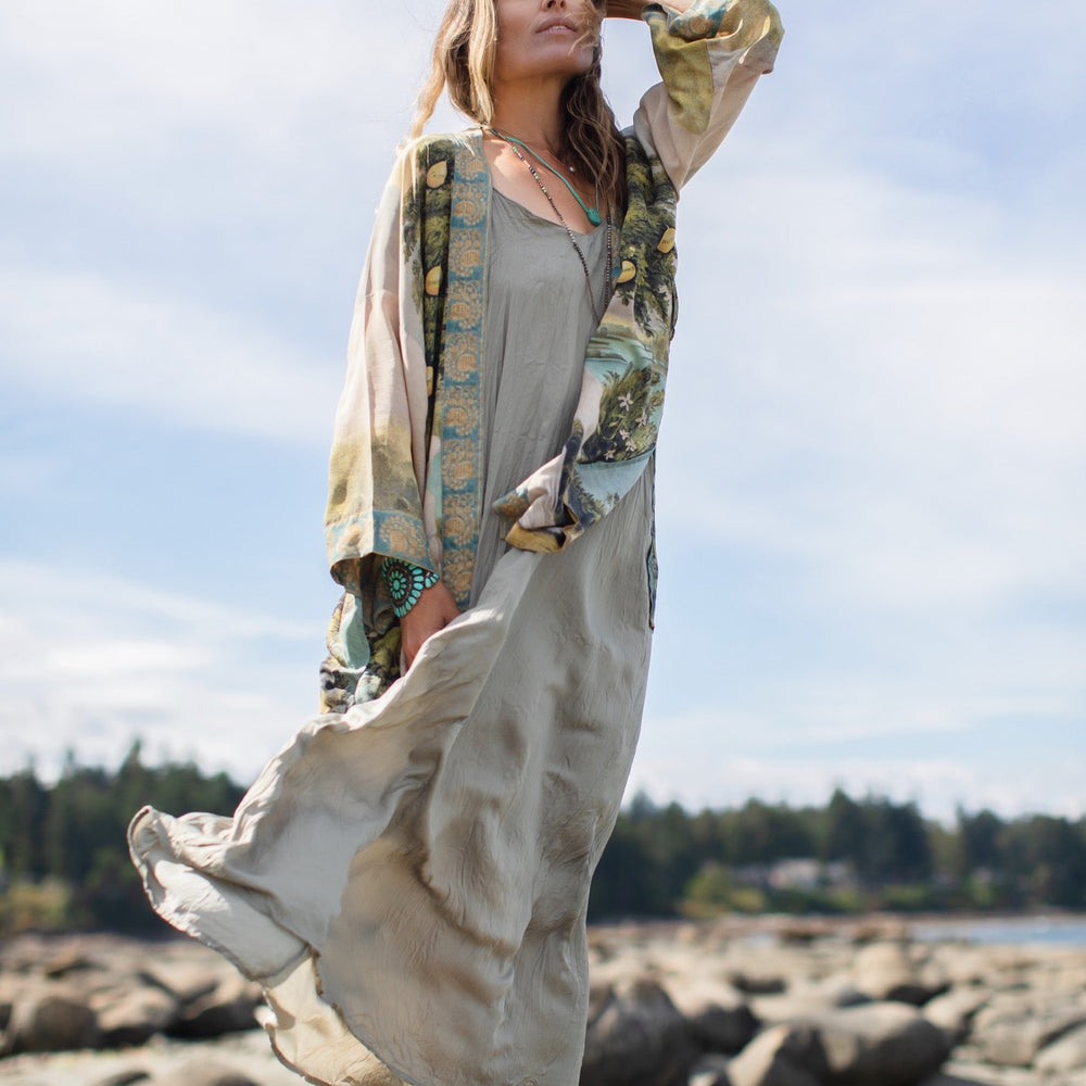 
                  
                    Model wearing Tree of Life Matinée Duster in aquas and verdant greens inspired by antique textiles – Market of Stars
                  
                
