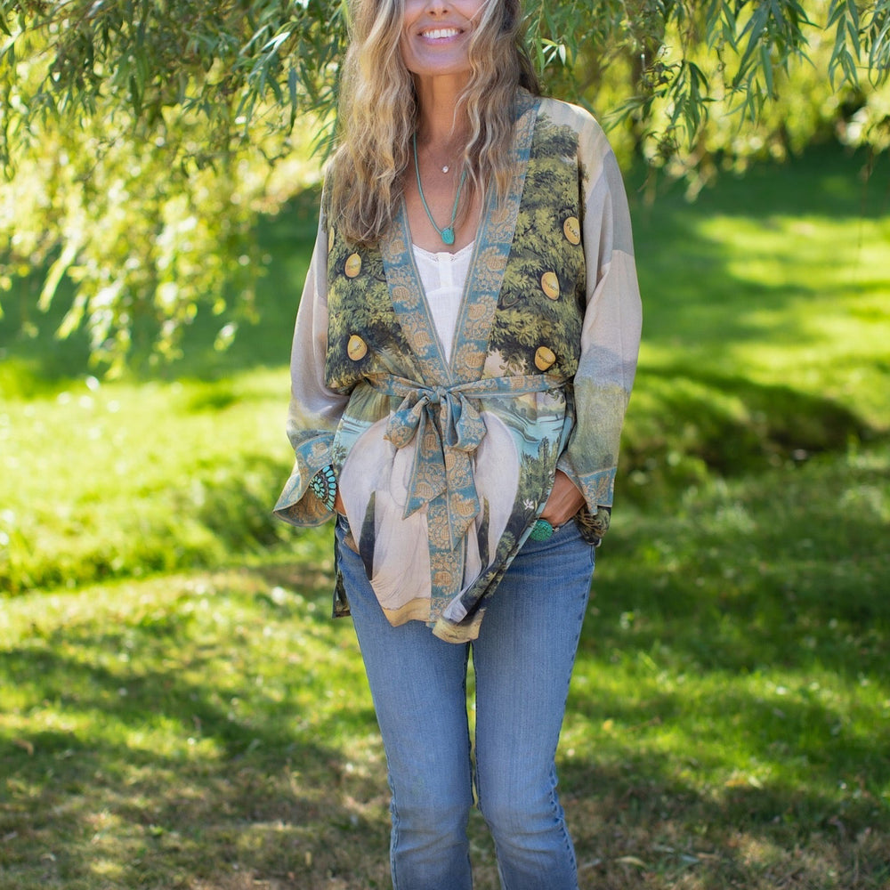 
                  
                    Model wearing Tree of Life Matinée Duster in aquas and verdant greens inspired by antique textiles – Market of Stars
                  
                