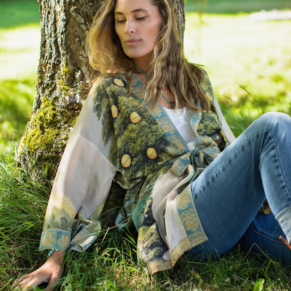 
                  
                    Model wearing Tree of Life Matinée Duster in aquas and verdant greens inspired by antique textiles – Market of Stars
                  
                