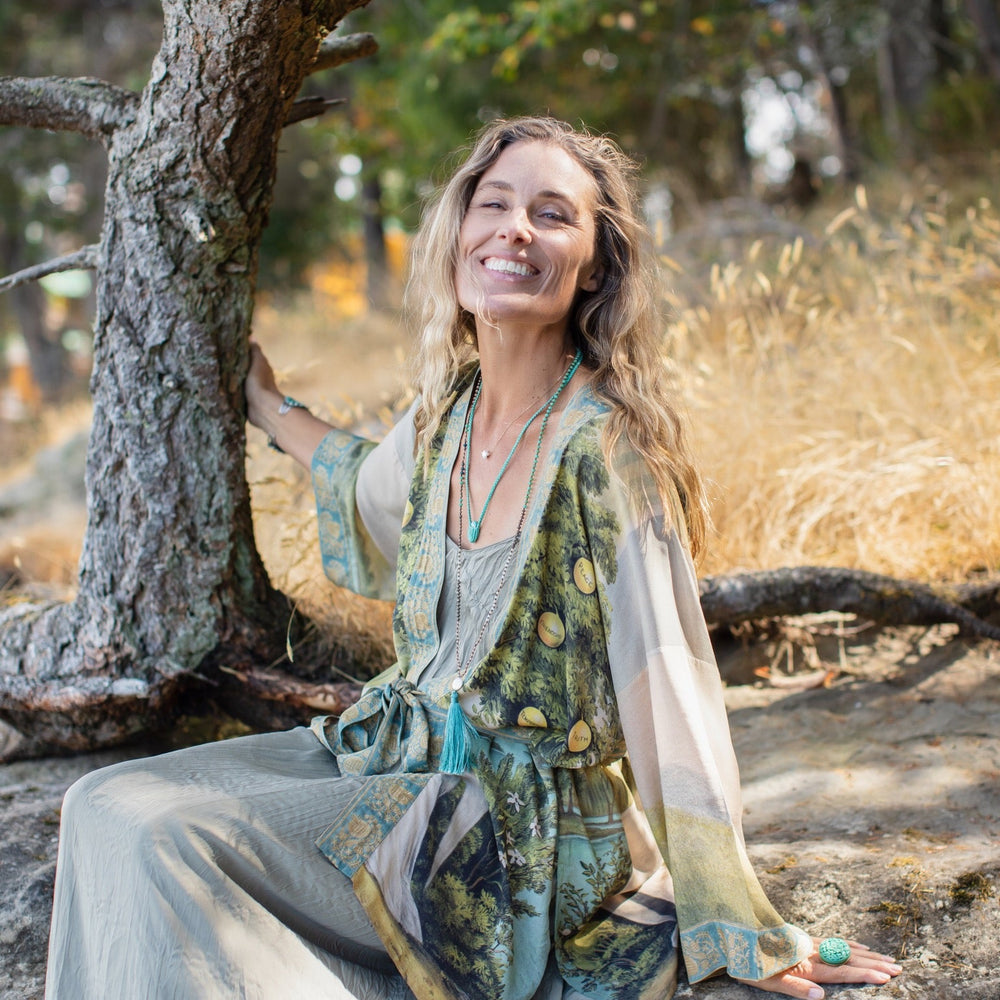 
                  
                    Model wearing Tree of Life Matinée Duster in aquas and verdant greens inspired by antique textiles – Market of Stars
                  
                