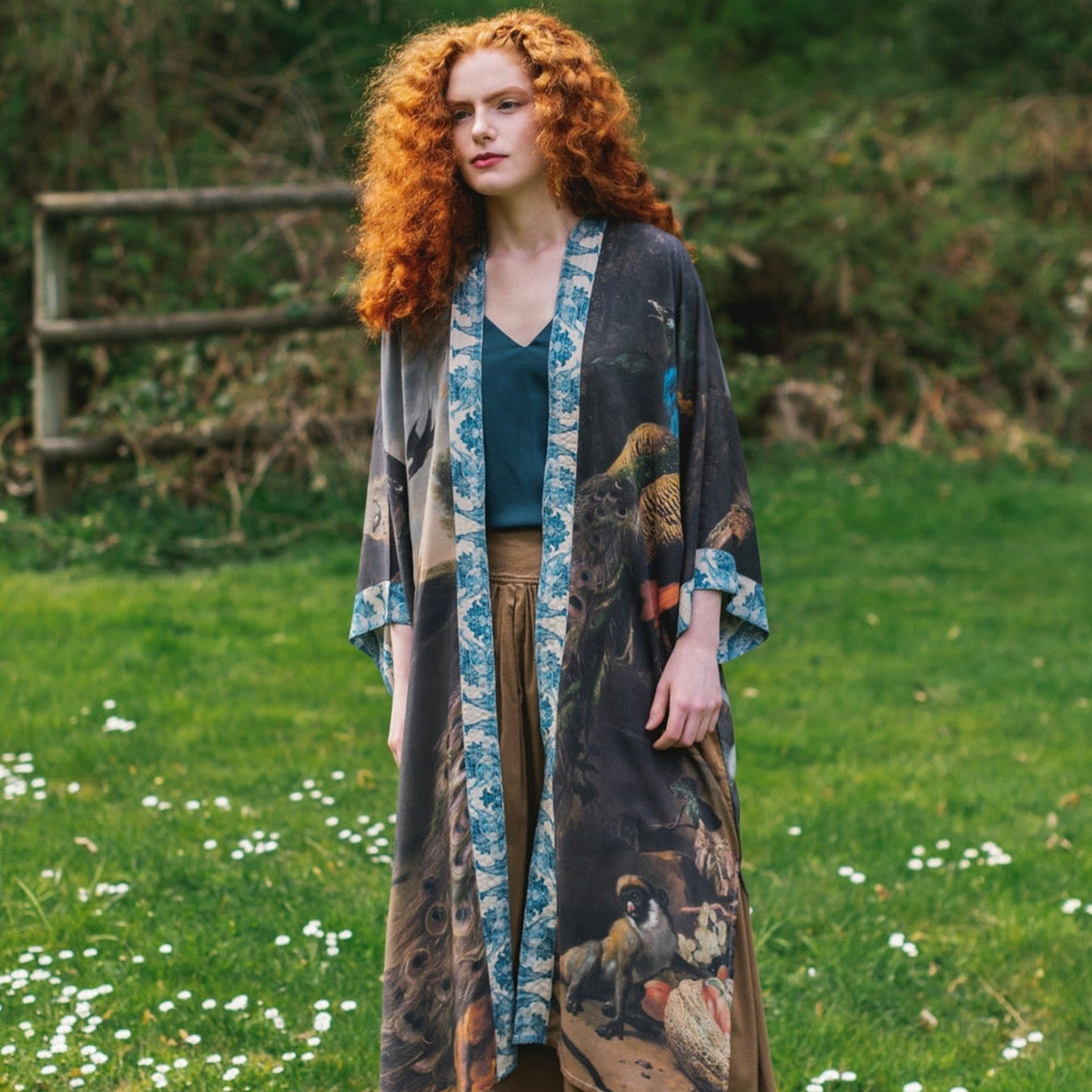 
                  
                    Model wearing Wild Beauty Opera Duster with antique lush florals and peacock – Market of Stars
                  
                